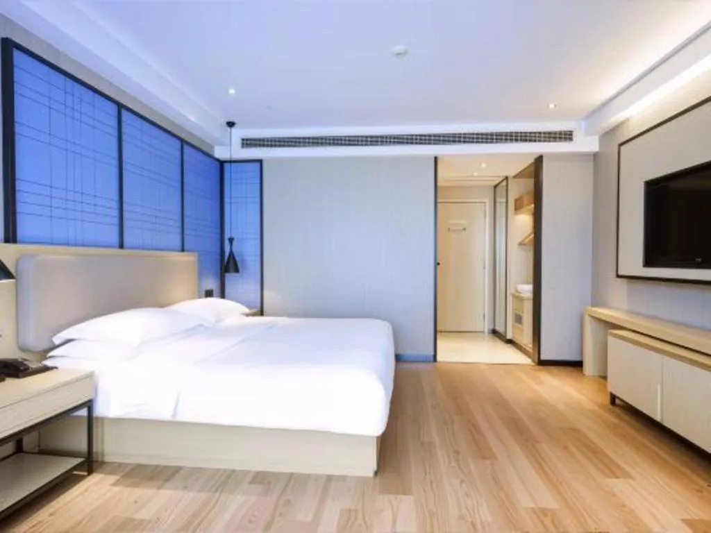 Bed in Echarm Hotel Aegean Shopping Park Zhonghuan Plaza