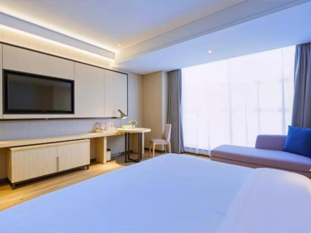 Bed in Echarm Hotel Aegean Shopping Park Zhonghuan Plaza