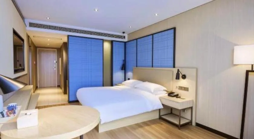 Bed in Echarm Hotel Aegean Shopping Park Zhonghuan Plaza