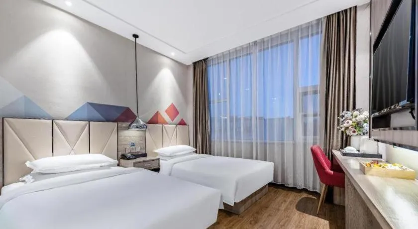 Bed in Borrman Hotel Tai'an Central Hospital Taishan Tianwai Village Hongmen