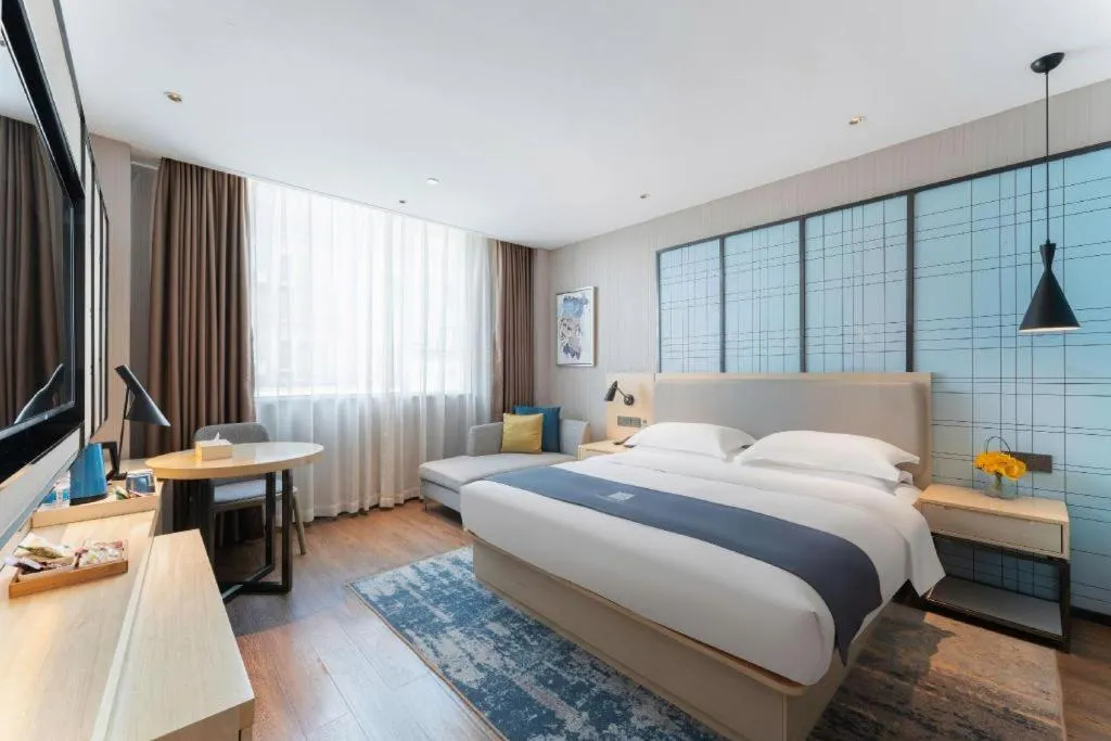 Bed in Echarm Hotel Guangzhou Changlong Shiqiao Metro Station