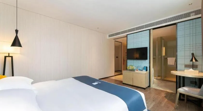 Bed in Echarm Hotel Guangzhou Changlong Shiqiao Metro Station