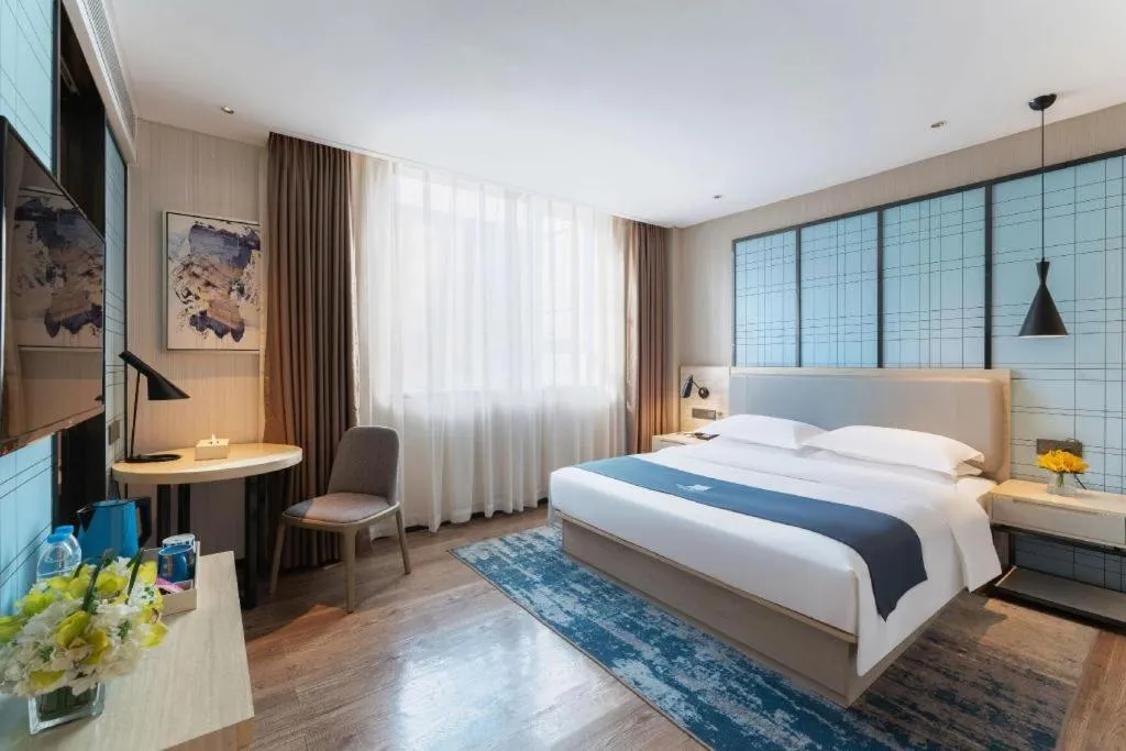 Bed in Echarm Hotel Guangzhou Changlong Shiqiao Metro Station