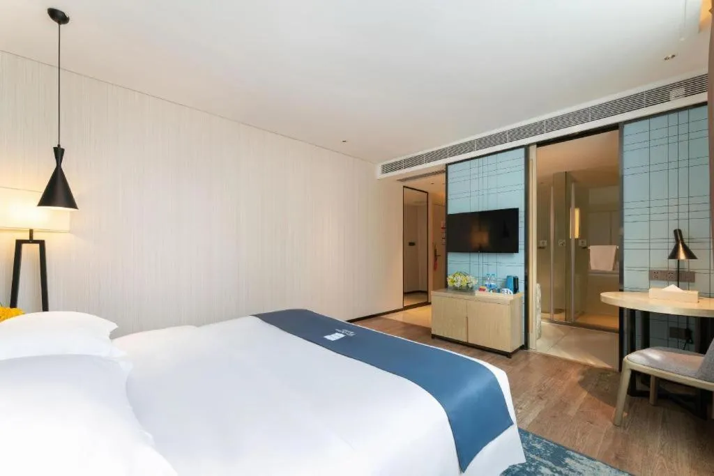 Bed in Echarm Hotel Guangzhou Changlong Shiqiao Metro Station