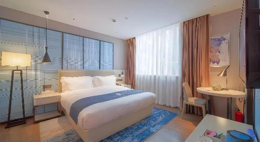 Bed in Echarm Hotel Guangzhou Changlong Shiqiao Metro Station