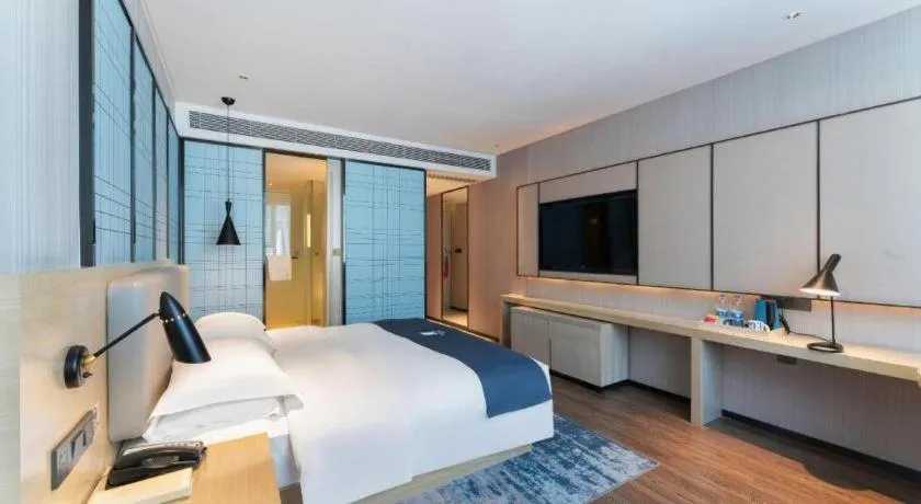 Bed in Echarm Hotel Guangzhou Changlong Shiqiao Metro Station