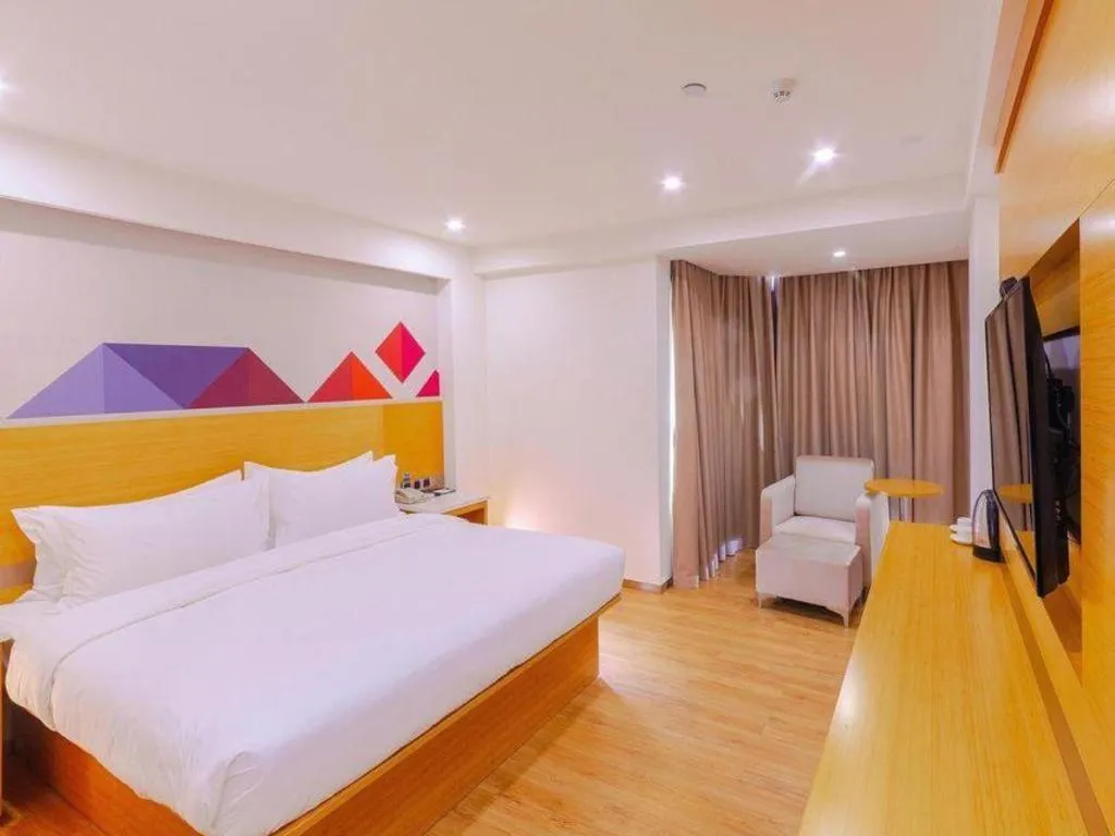 Bed in Borrman Hotel Zhanjiang Shimao Building High-speed Railway Station