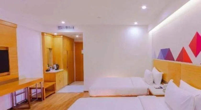 Bed in Borrman Hotel Zhanjiang Shimao Building High-speed Railway Station