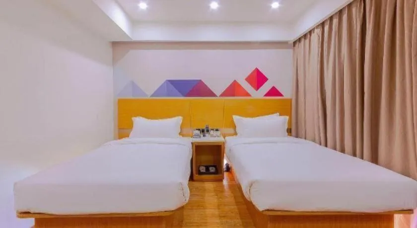 Bed in Borrman Hotel Zhanjiang Shimao Building High-speed Railway Station