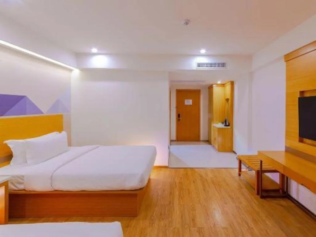 Bed in Borrman Hotel Zhanjiang Shimao Building High-speed Railway Station