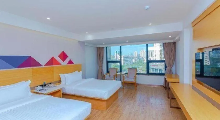 Bed in Borrman Hotel Zhanjiang Shimao Building High-speed Railway Station