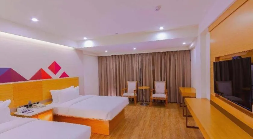 Bed in Borrman Hotel Zhanjiang Shimao Building High-speed Railway Station