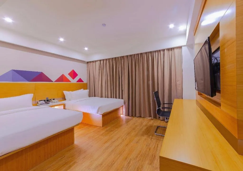 Bed in Borrman Hotel Zhanjiang Shimao Building High-speed Railway Station