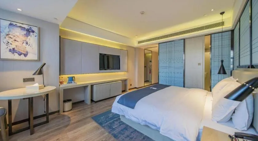 Bed in Echarm Hotel Changsha Guihua Park Metro Station