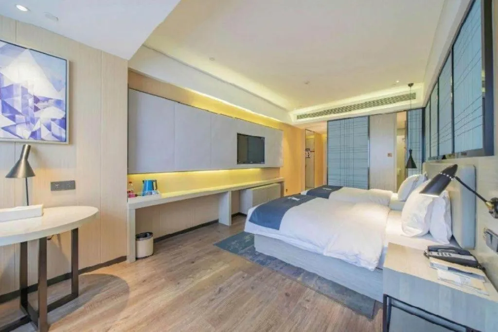 Bed in Echarm Hotel Changsha Guihua Park Metro Station