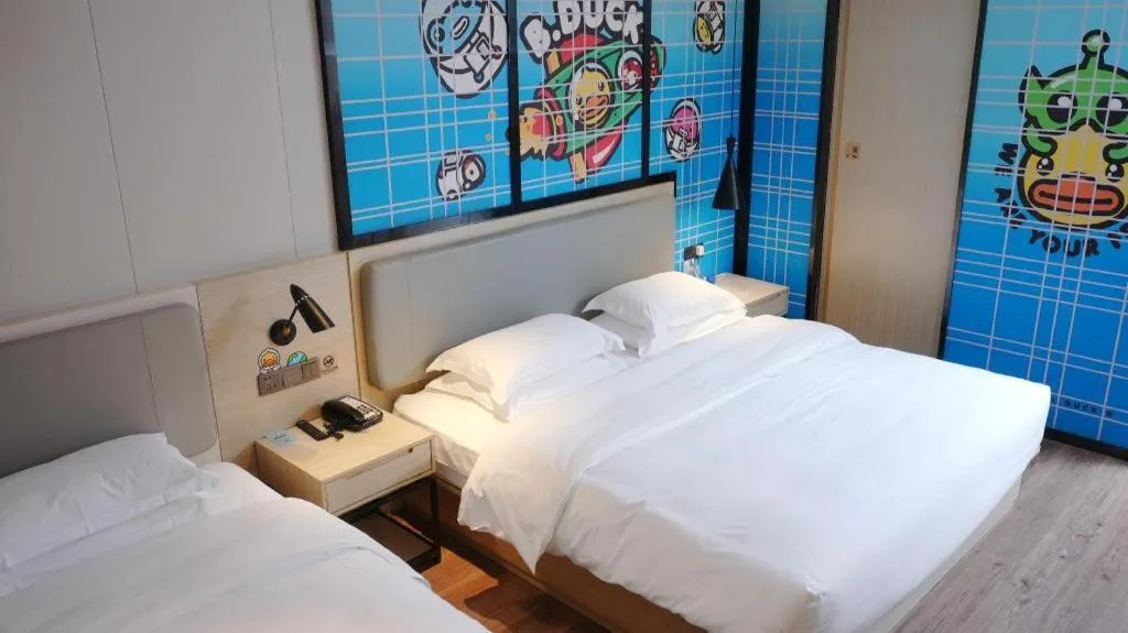 Bed in Echarm Hotel Changsha Guihua Park Metro Station