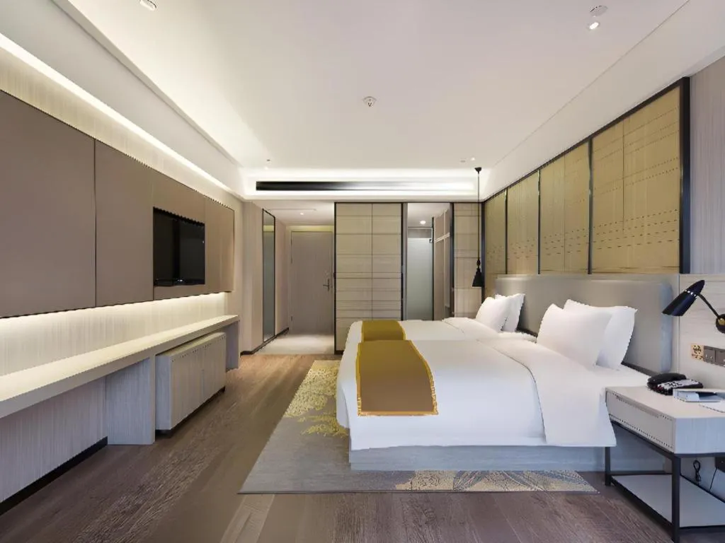 Bed in Echarm Hotel Changsha Guihua Park Metro Station