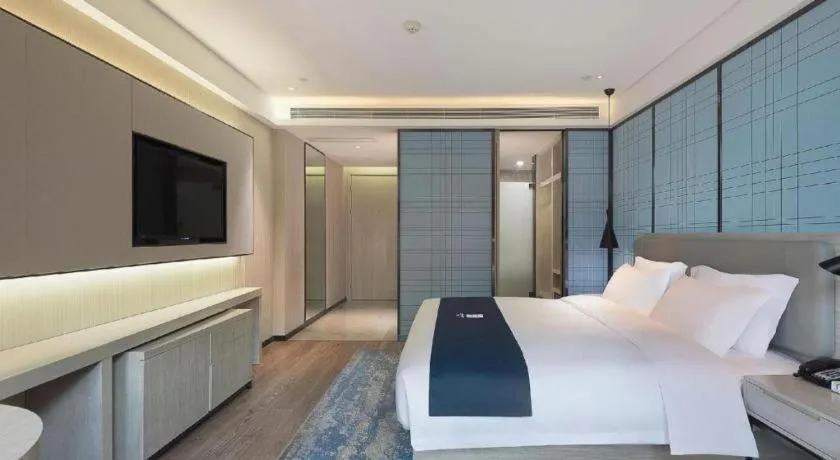 Bed in Echarm Hotel Changsha Guihua Park Metro Station