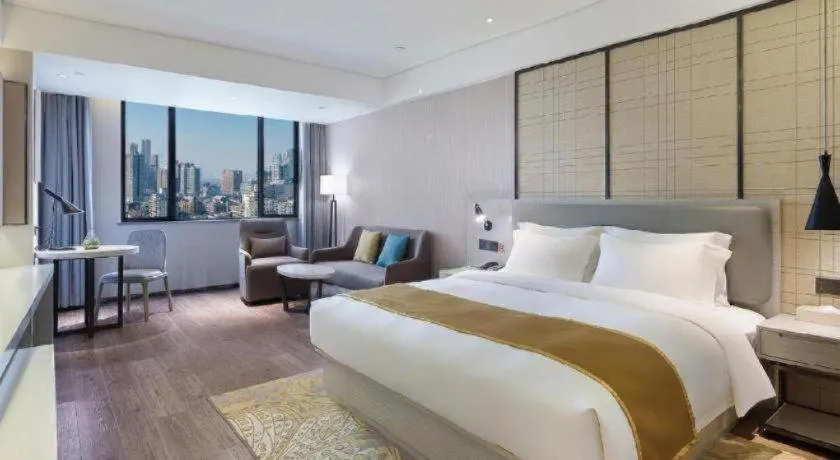 Bed in Echarm Hotel Changsha Guihua Park Metro Station