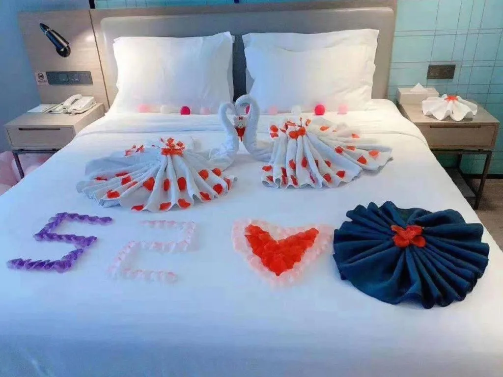 Bed in Echarm Hotel Changsha Guihua Park Metro Station