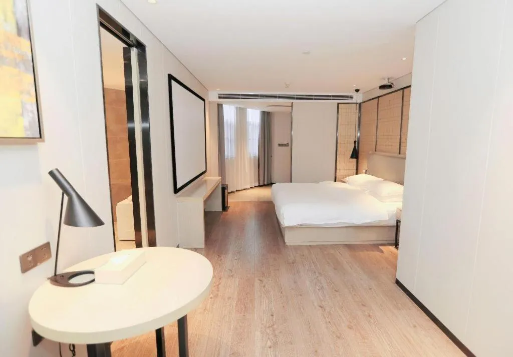 Bed in Echarm Hotel Changsha Guihua Park Metro Station