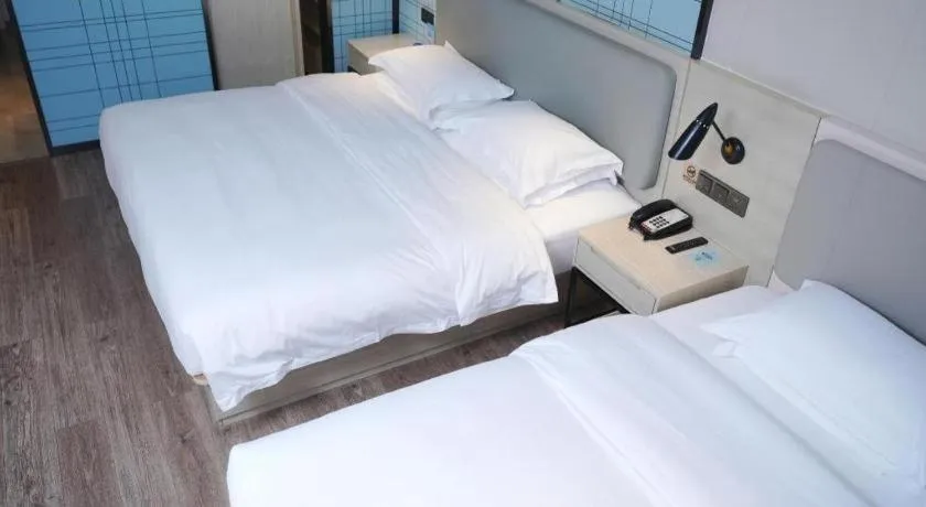 Bed in Echarm Hotel Changsha Guihua Park Metro Station
