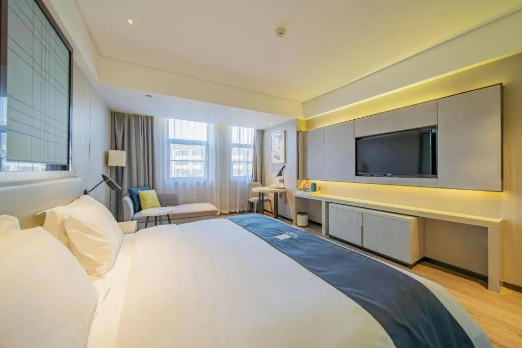 Bed in Echarm Hotel Changsha Guihua Park Metro Station