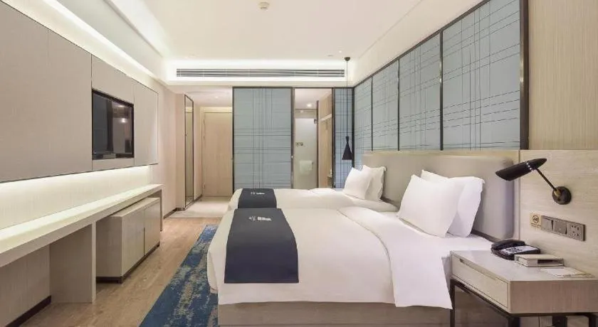 Bed in Echarm Hotel Changsha Guihua Park Metro Station