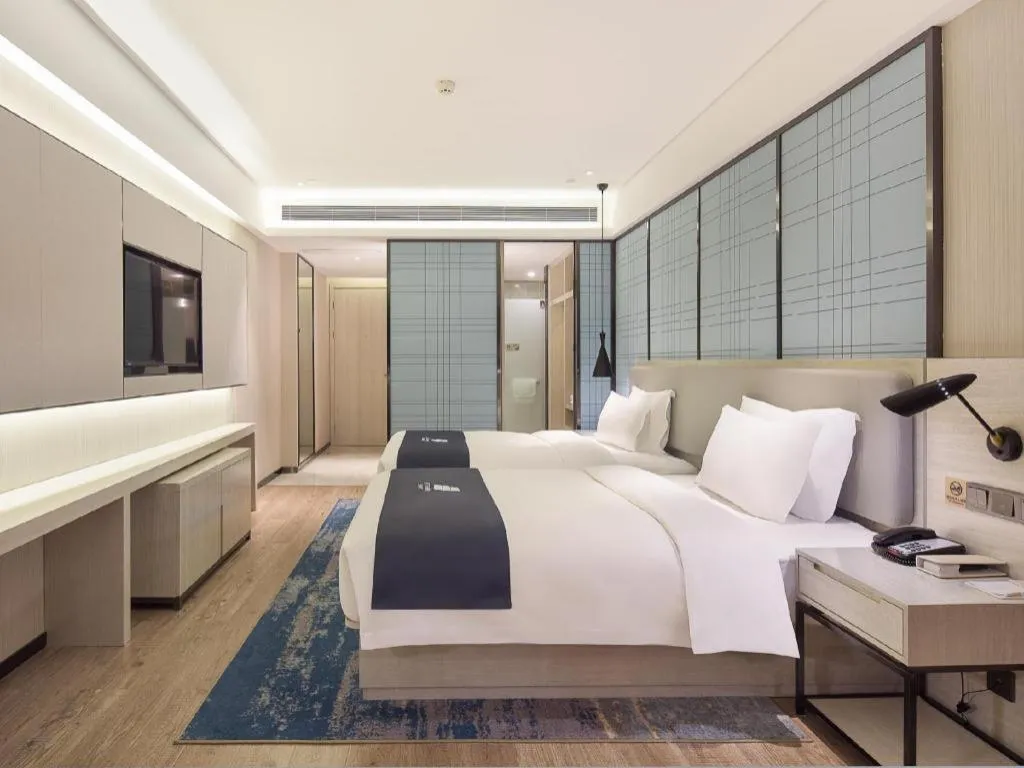 Bed in Echarm Hotel Changsha Guihua Park Metro Station