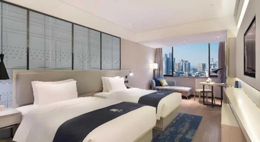 Bed in Echarm Hotel Changsha Guihua Park Metro Station