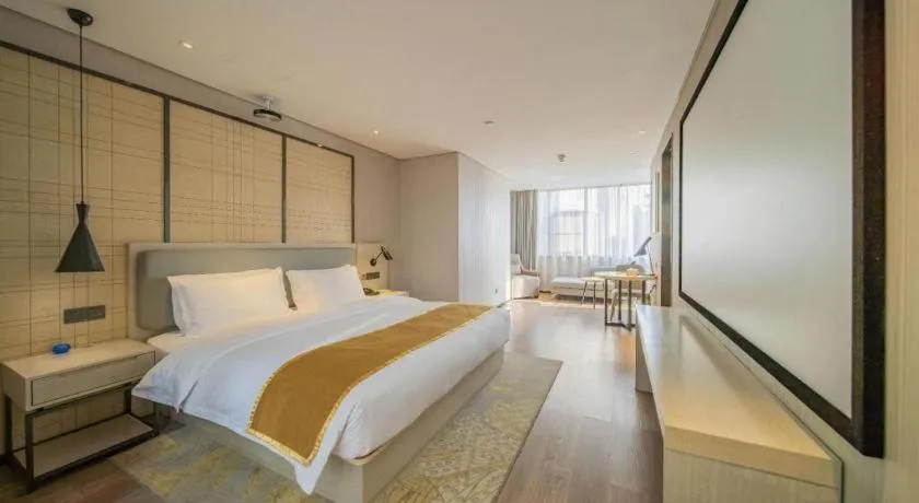 Bed in Echarm Hotel Changsha Guihua Park Metro Station