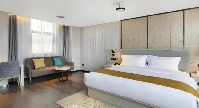 Bed in Echarm Hotel Changsha Guihua Park Metro Station