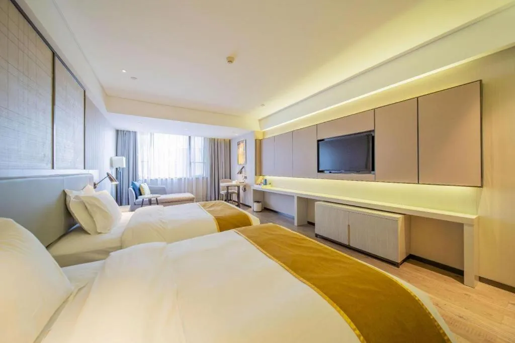 Bed in Echarm Hotel Changsha Guihua Park Metro Station