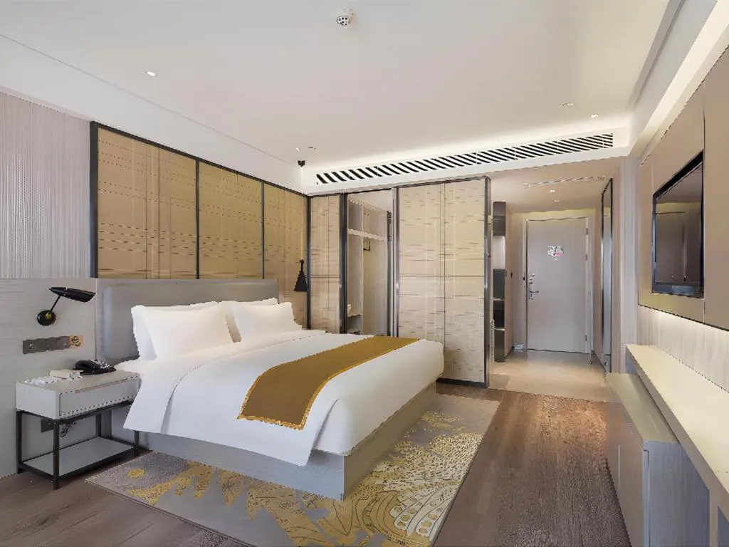 Bed in Echarm Hotel Changsha Guihua Park Metro Station