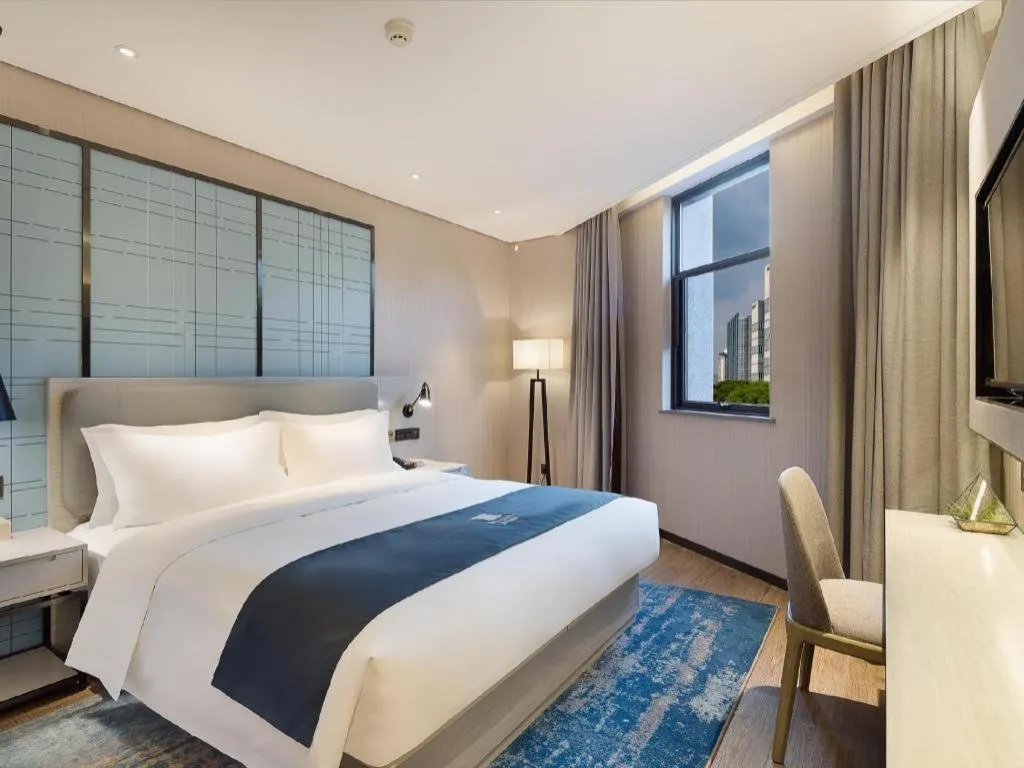 Bed in Echarm Hotel Changsha Guihua Park Metro Station