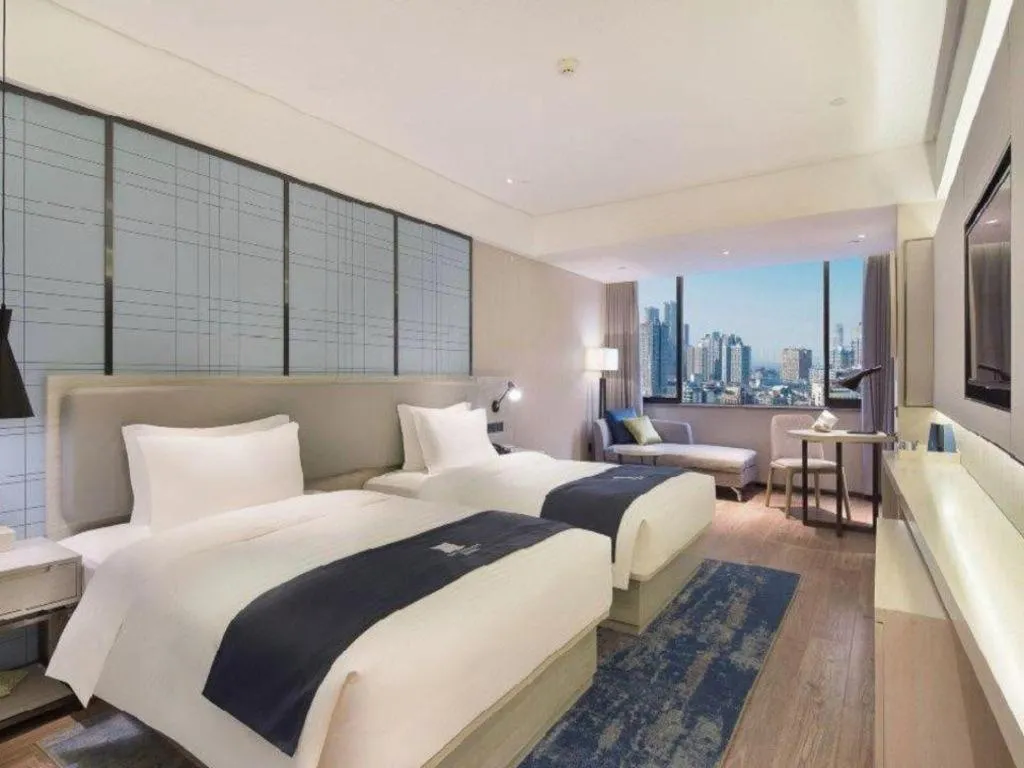 Bed in Echarm Hotel Changsha Guihua Park Metro Station