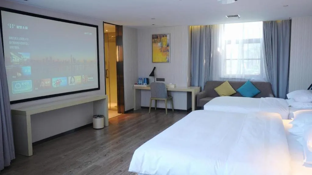 Bed in Echarm Hotel Changsha Guihua Park Metro Station