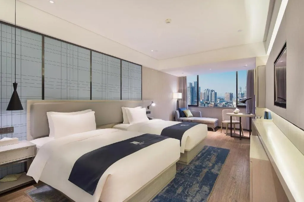 Bed in Echarm Hotel Changsha Guihua Park Metro Station