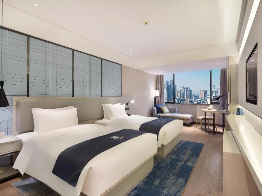 Bed in Echarm Hotel Changsha Guihua Park Metro Station