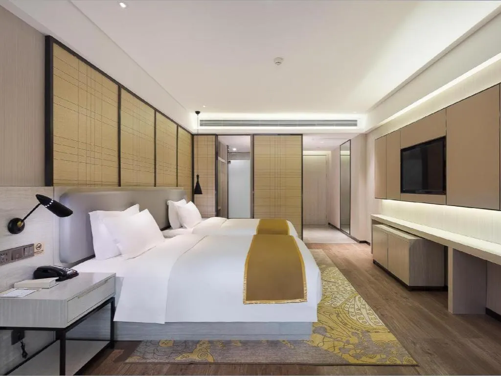 Bed in Echarm Hotel Changsha Guihua Park Metro Station