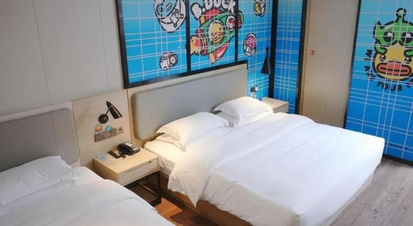 Bed in Echarm Hotel Changsha Guihua Park Metro Station