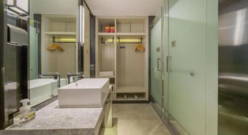 Bed in Echarm Hotel Changsha Guihua Park Metro Station