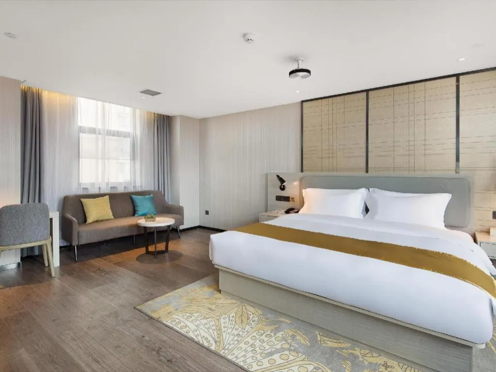 Bed in Echarm Hotel Changsha Guihua Park Metro Station