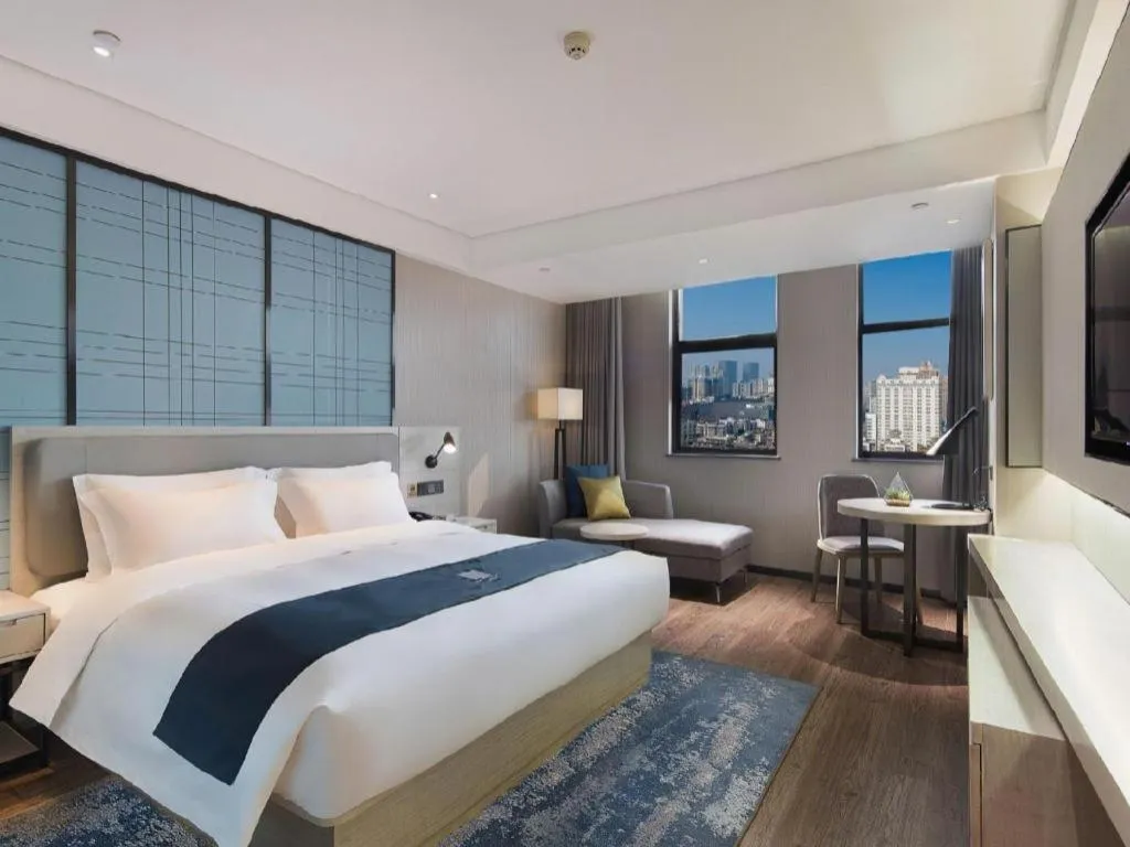 Bed in Echarm Hotel Changsha Guihua Park Metro Station