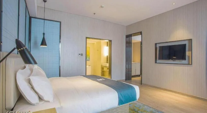 Bed in Echarm Hotel Xinyu Railway Station Baoshi Park