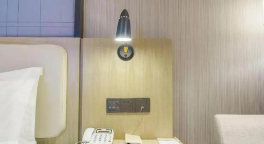 Bed in Echarm Hotel Xinyu Railway Station Baoshi Park