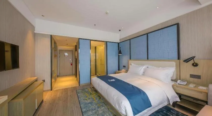 Bed in Echarm Hotel Xinyu Railway Station Baoshi Park