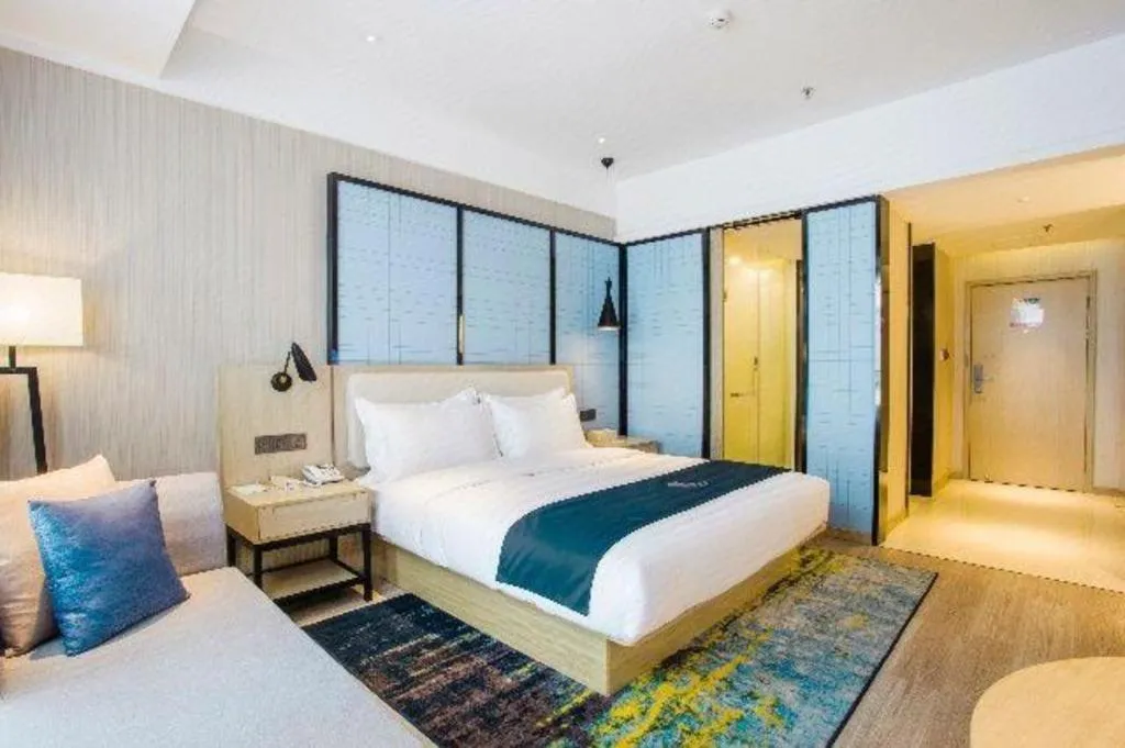 Bed in Echarm Hotel Xinyu Railway Station Baoshi Park