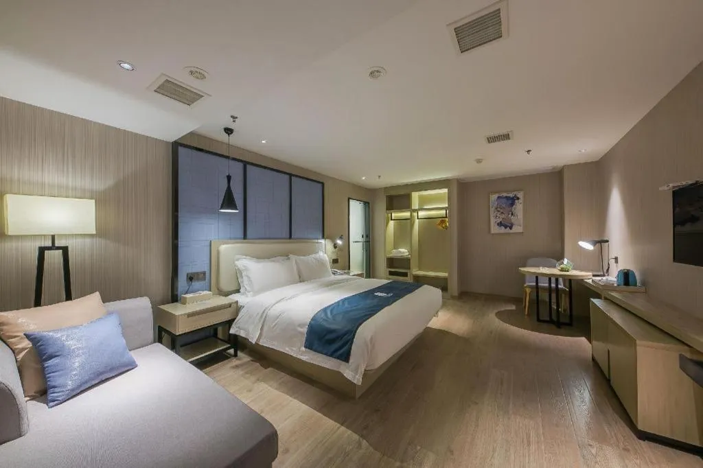 Bed in Echarm Hotel Xinyu Railway Station Baoshi Park