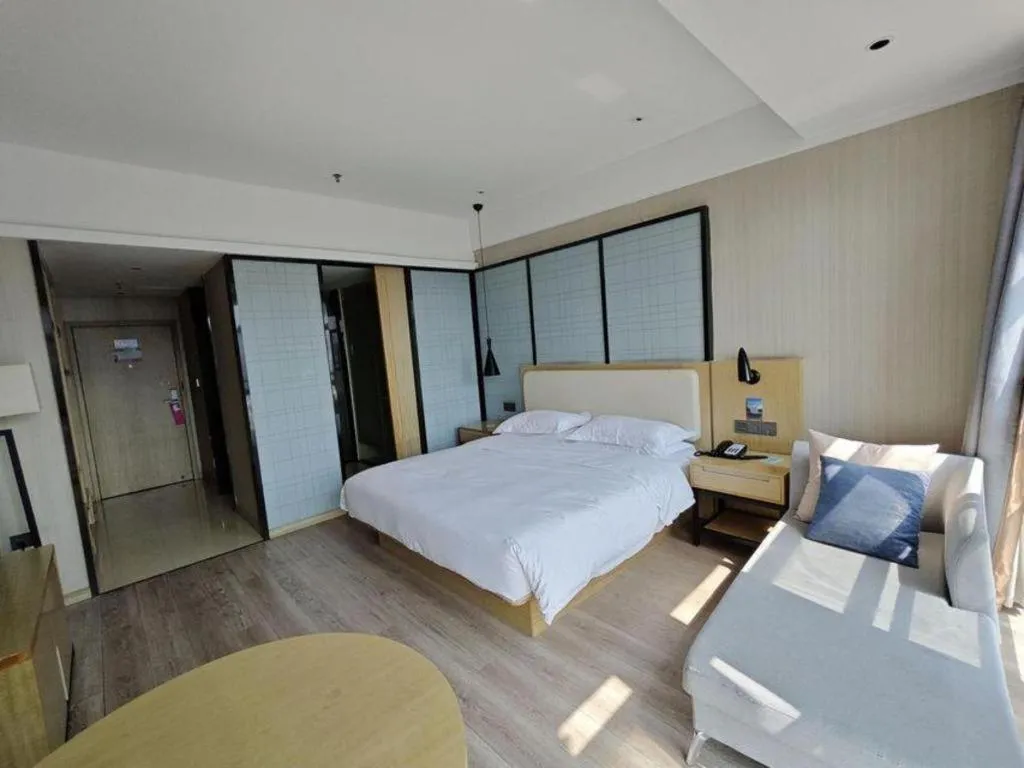 Bed in Echarm Hotel Xinyu Railway Station Baoshi Park